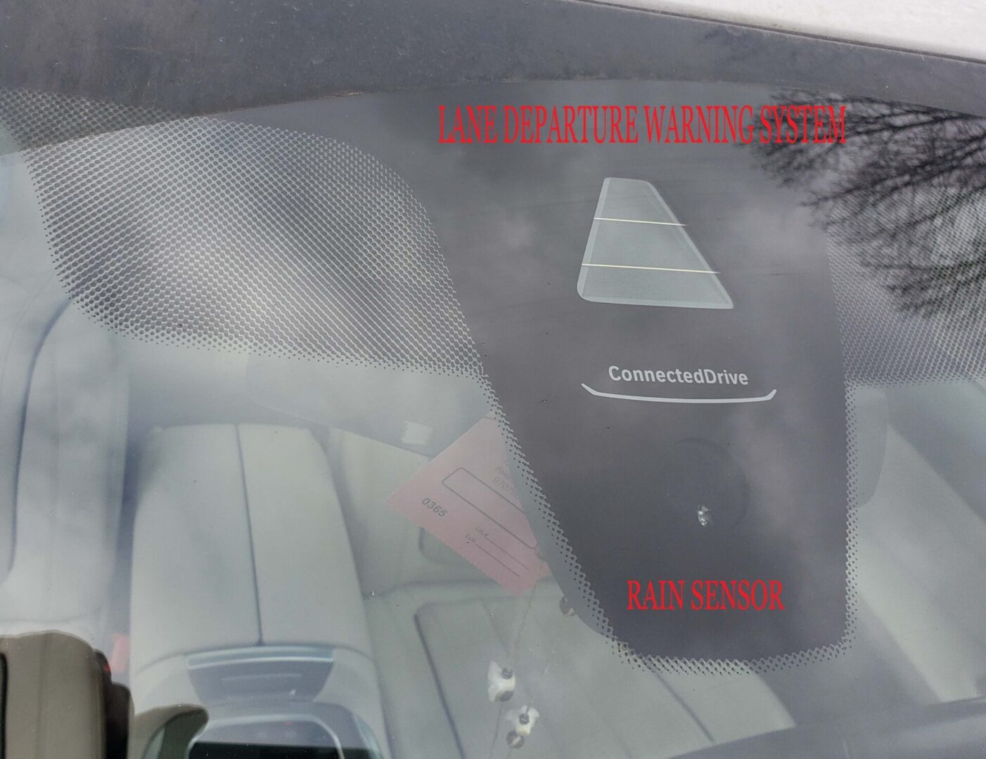 A car dashboard with smoke coming from the windshield.